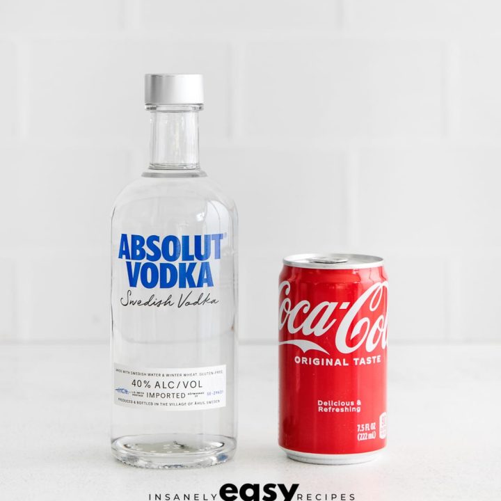 vodka bottle on left, coke can on right