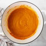 smooth orange liquid in white pot