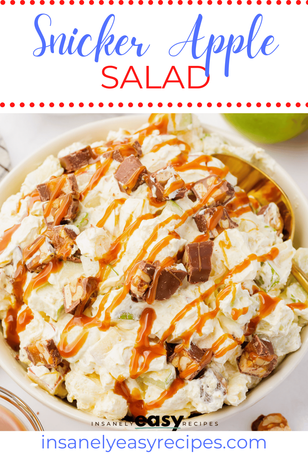 Snicker Apple Salad in a white bowl. Looks like fluffy white stuff, with apple chunks, snickers chunks, marshmallows and caramel sauce, with text overlay: snicker apple salad
