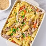 leftover turkey pasta bake in a white dish you can see pasta, cheese, turkey, vegetables