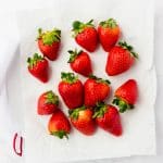 white plate with red strawberries