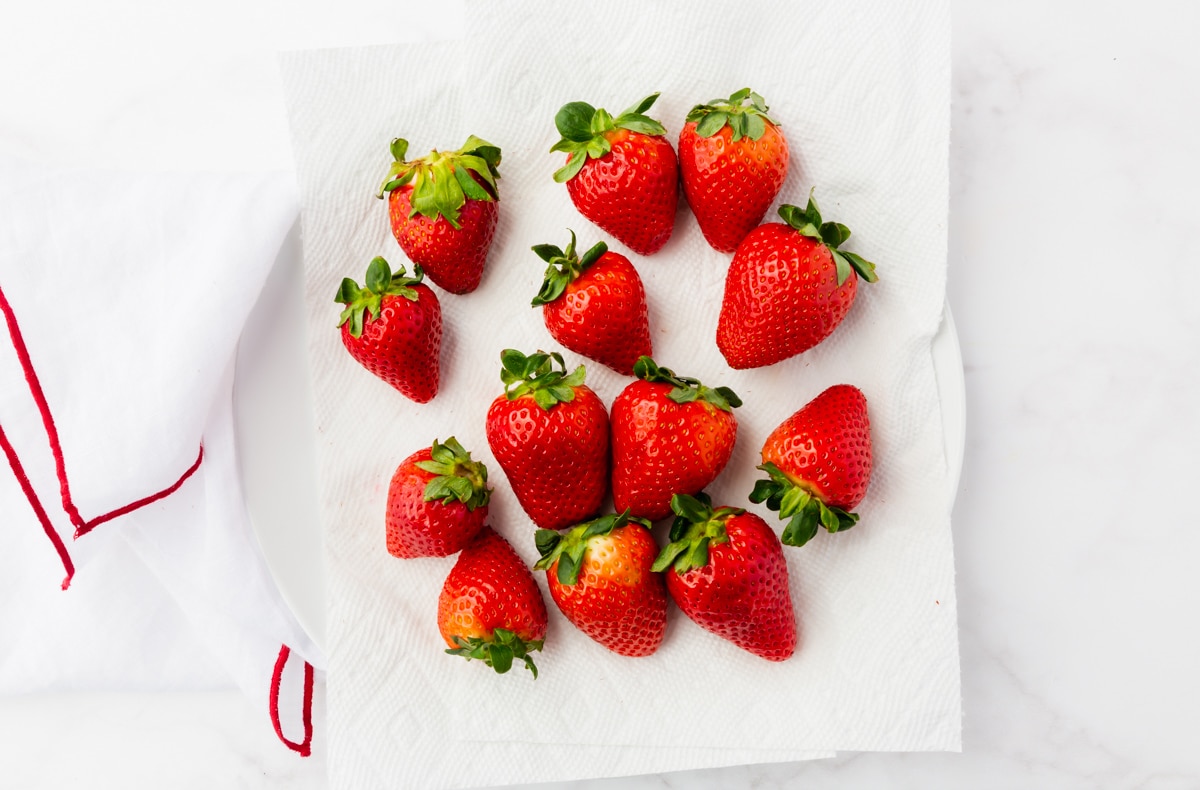 white plate with red strawberries