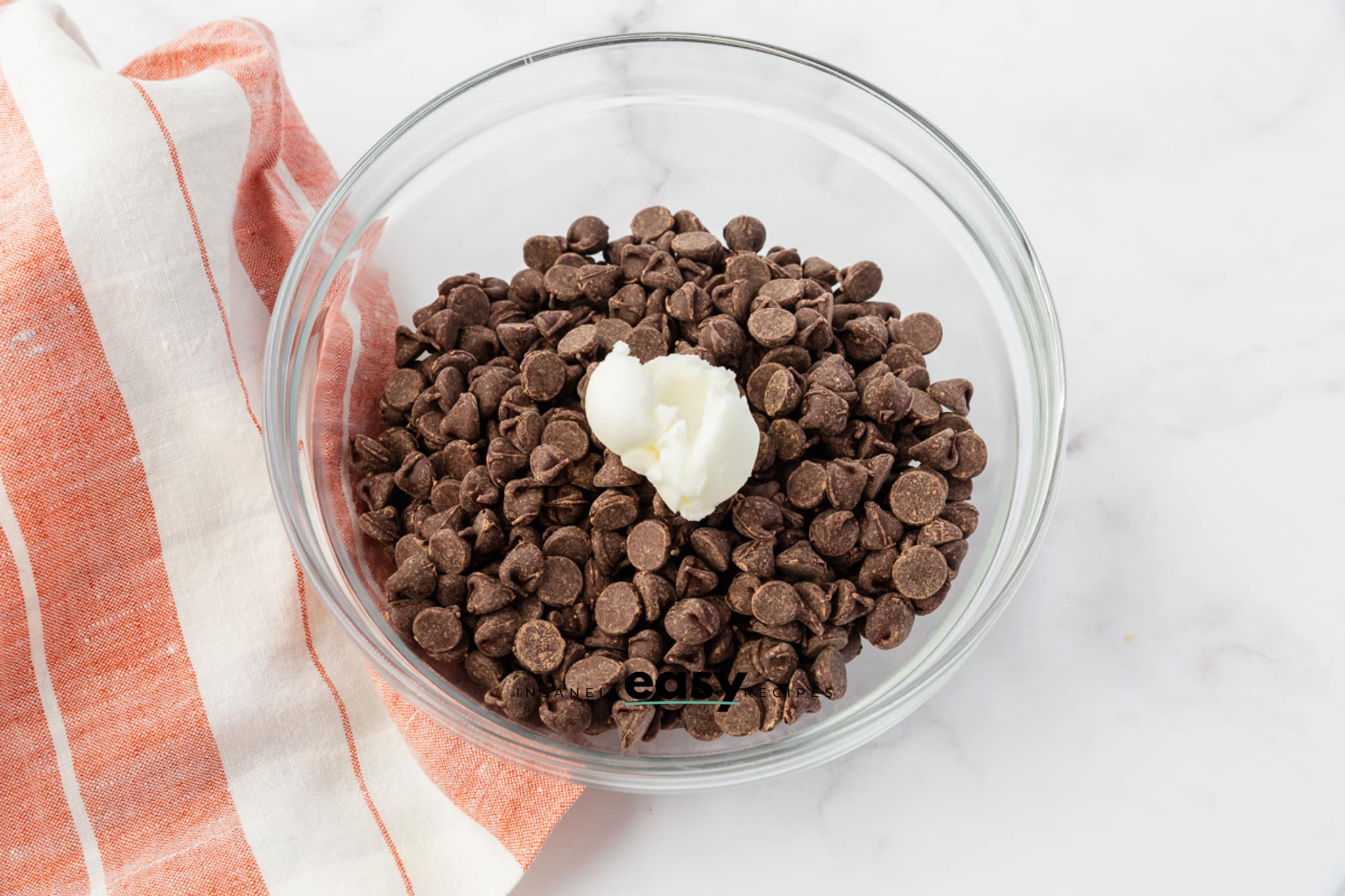 chocolate chips and shortening in a small glass bowl