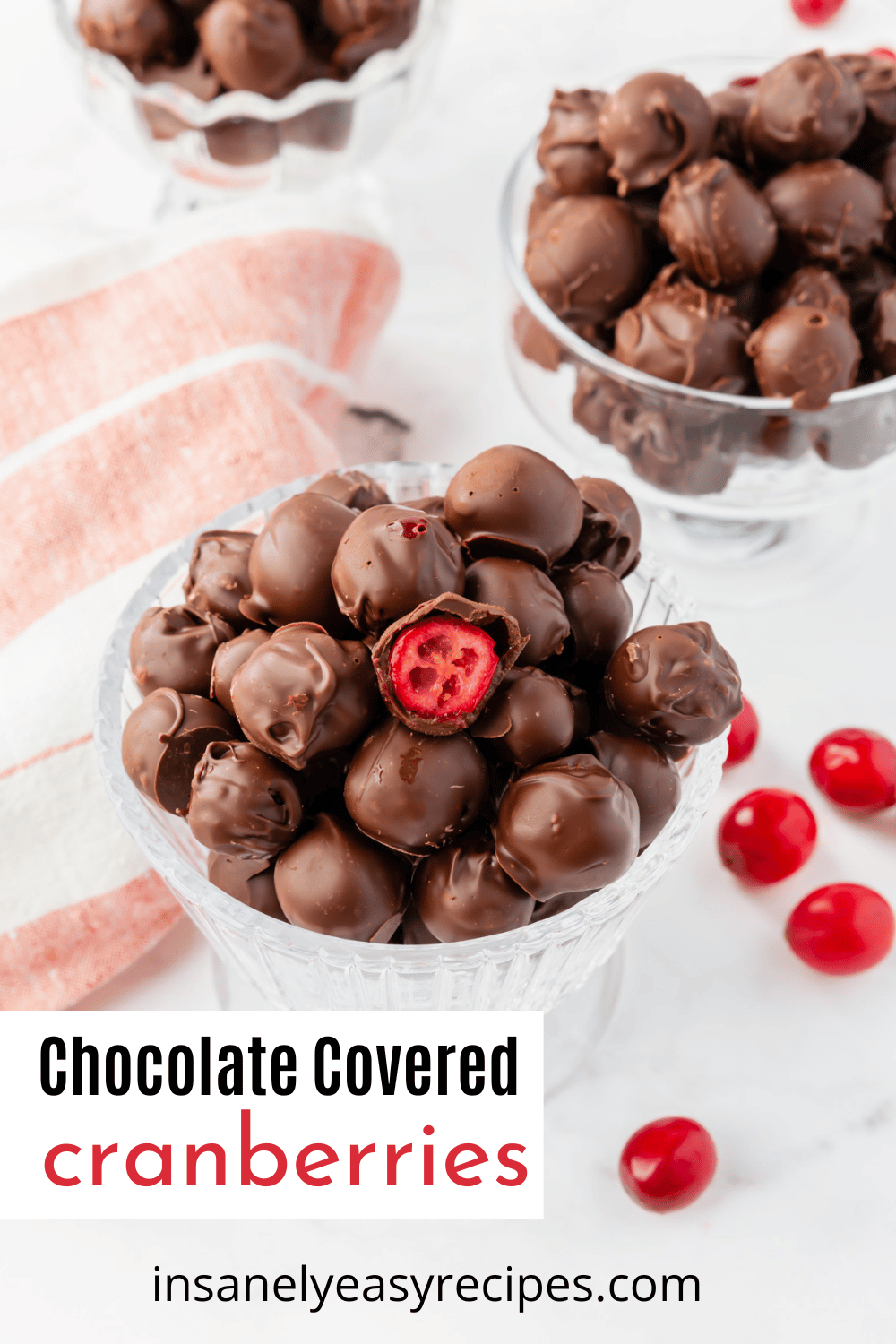 a footed dessert dish filled with chocolate covered fresh cranberries.