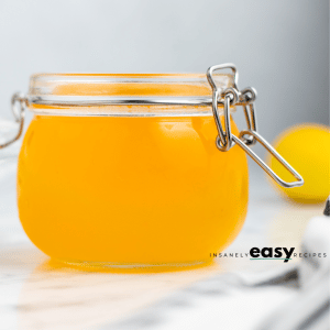 photo of peach simple syrup in a glass jar with lid secured tightly