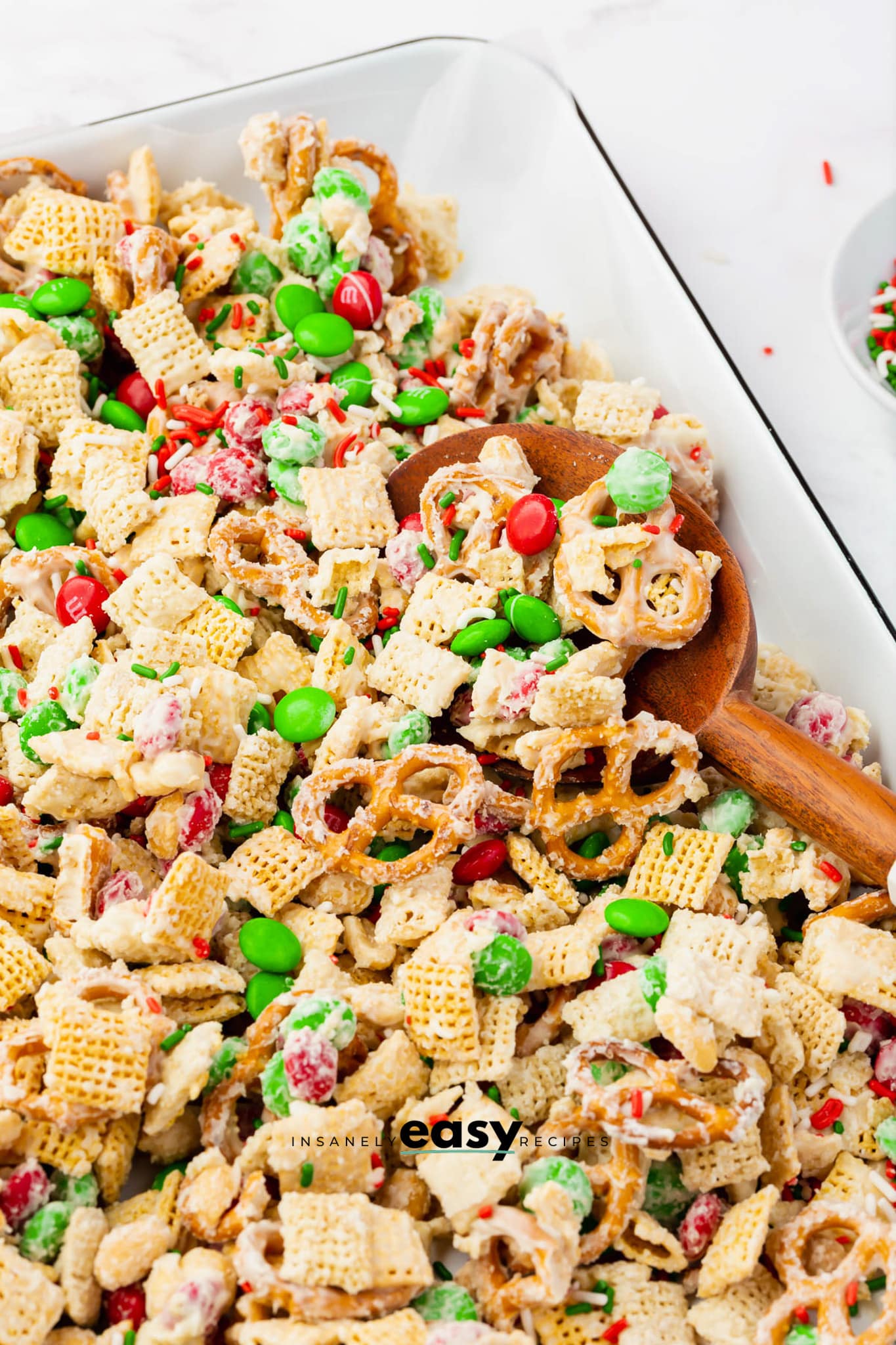 Extra M&ms and sprinkles added to white chocolate chex mix.