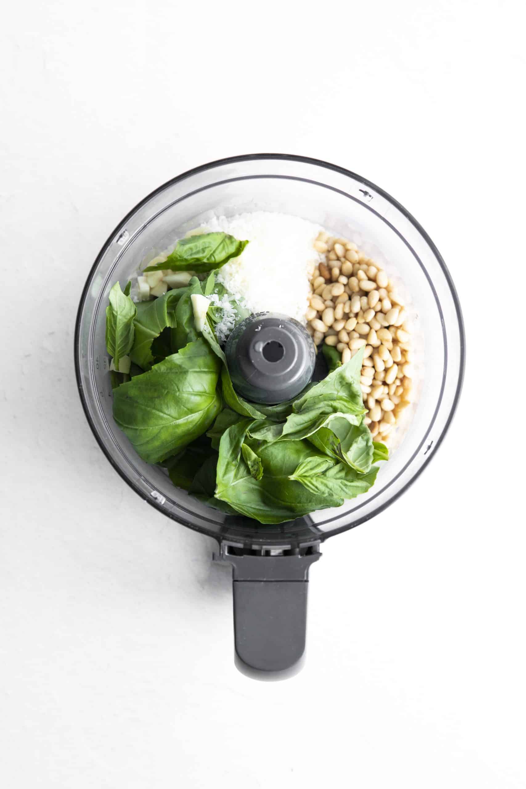 basil, pinenuts, and cheese in a food processor