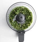 basil pesto in a food processor, before oil is added