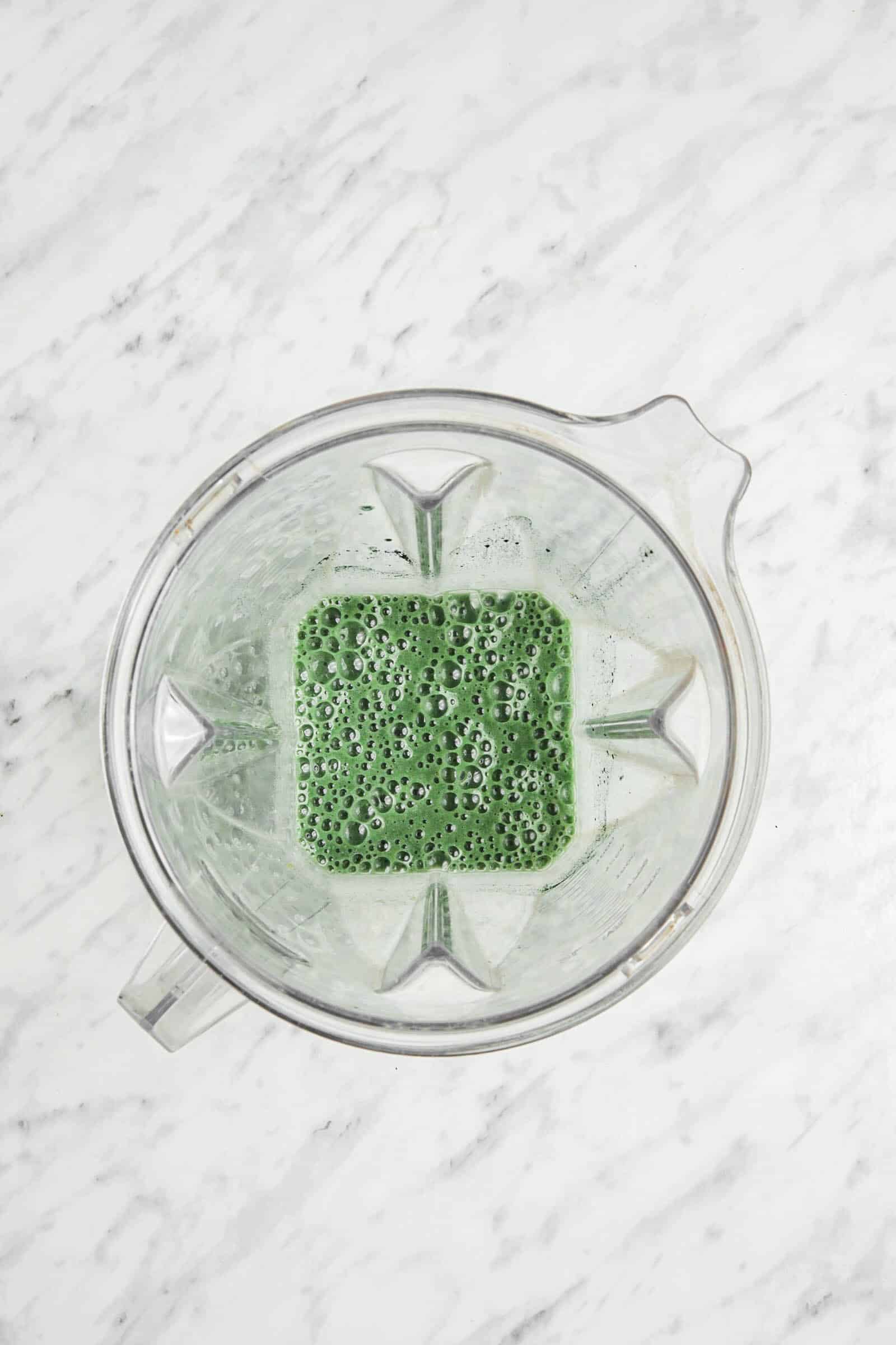 Topview photo of Spirulina Smoothie in a blender, mixed together.