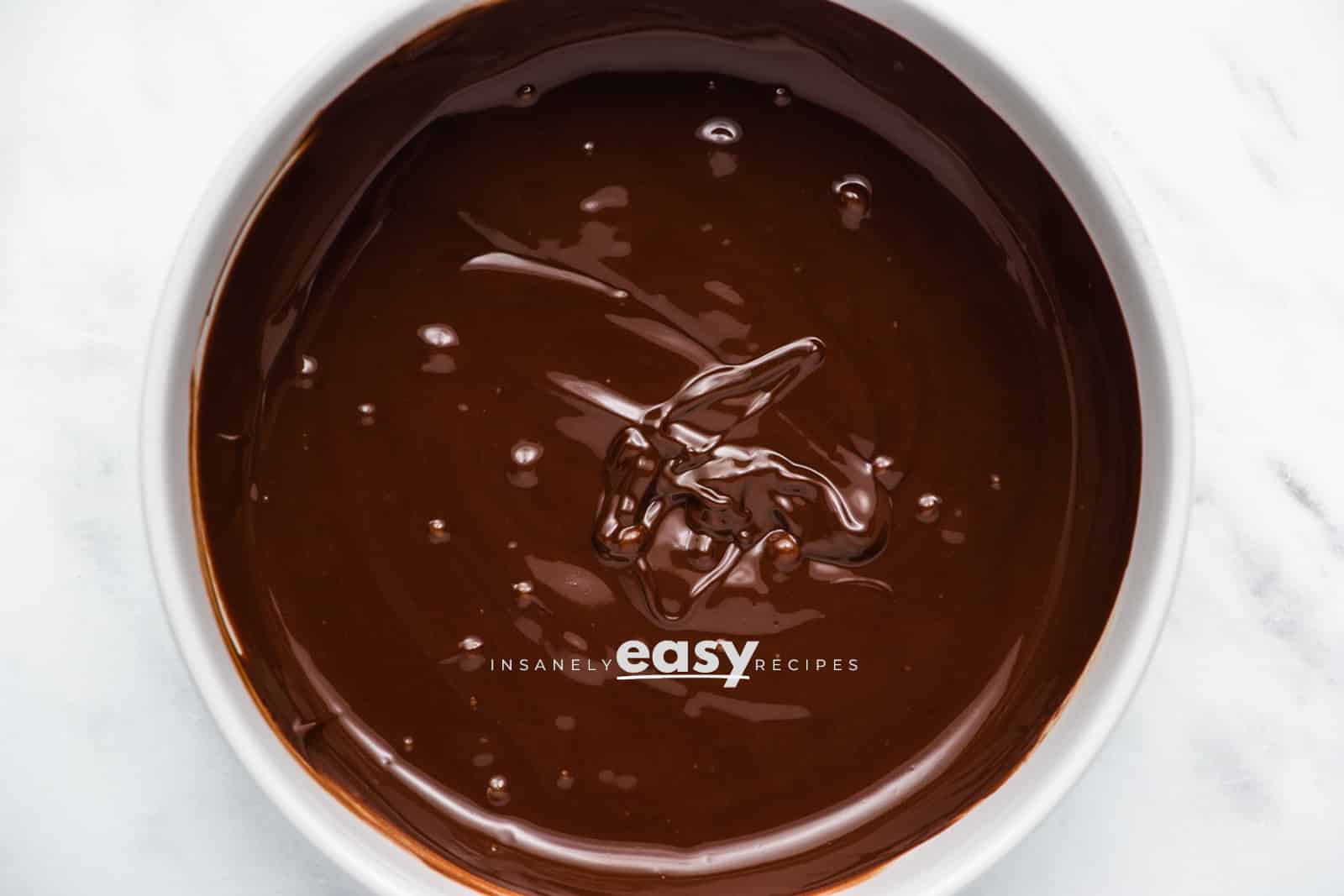 closeup photo of melted chocolate in a white bowl