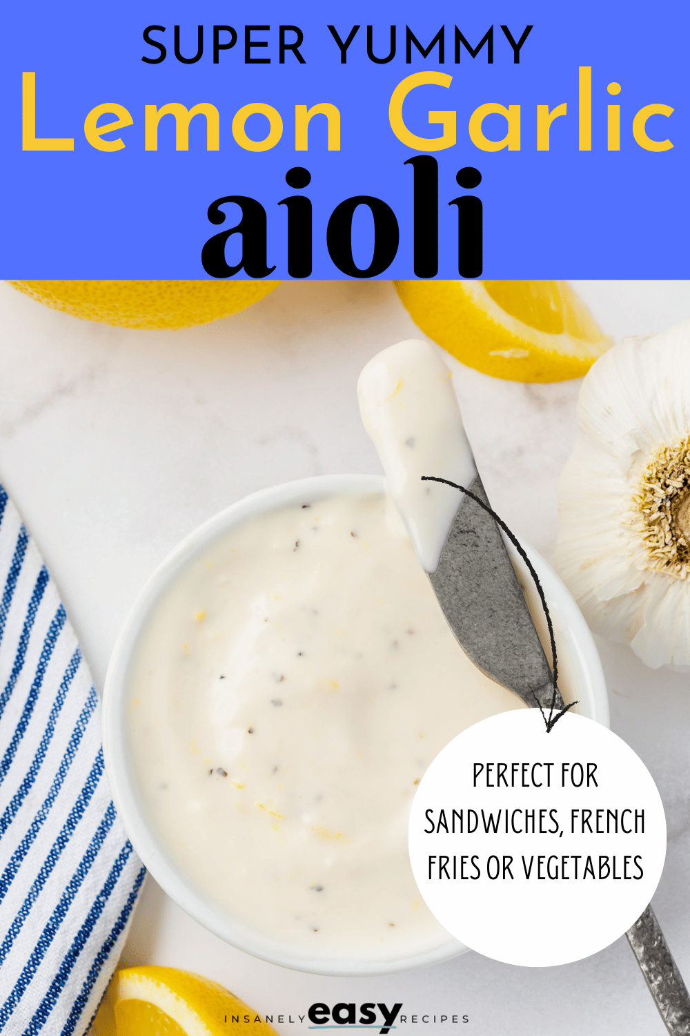 a small bowl of creamy aioli on a counter with lemon slices. Text at top of image says "super yummy lemon garlic aioli"
