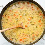 Creamy bean soup, simmering in a stock pot.