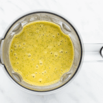 Kale soup, blended, in a blender, viewed from above.