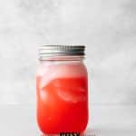 ball jar with red liquid, ice and lid