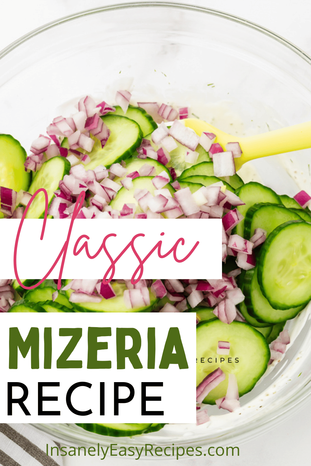 clear bowl with sliced red onion and cucumbers in it, called mizera salad