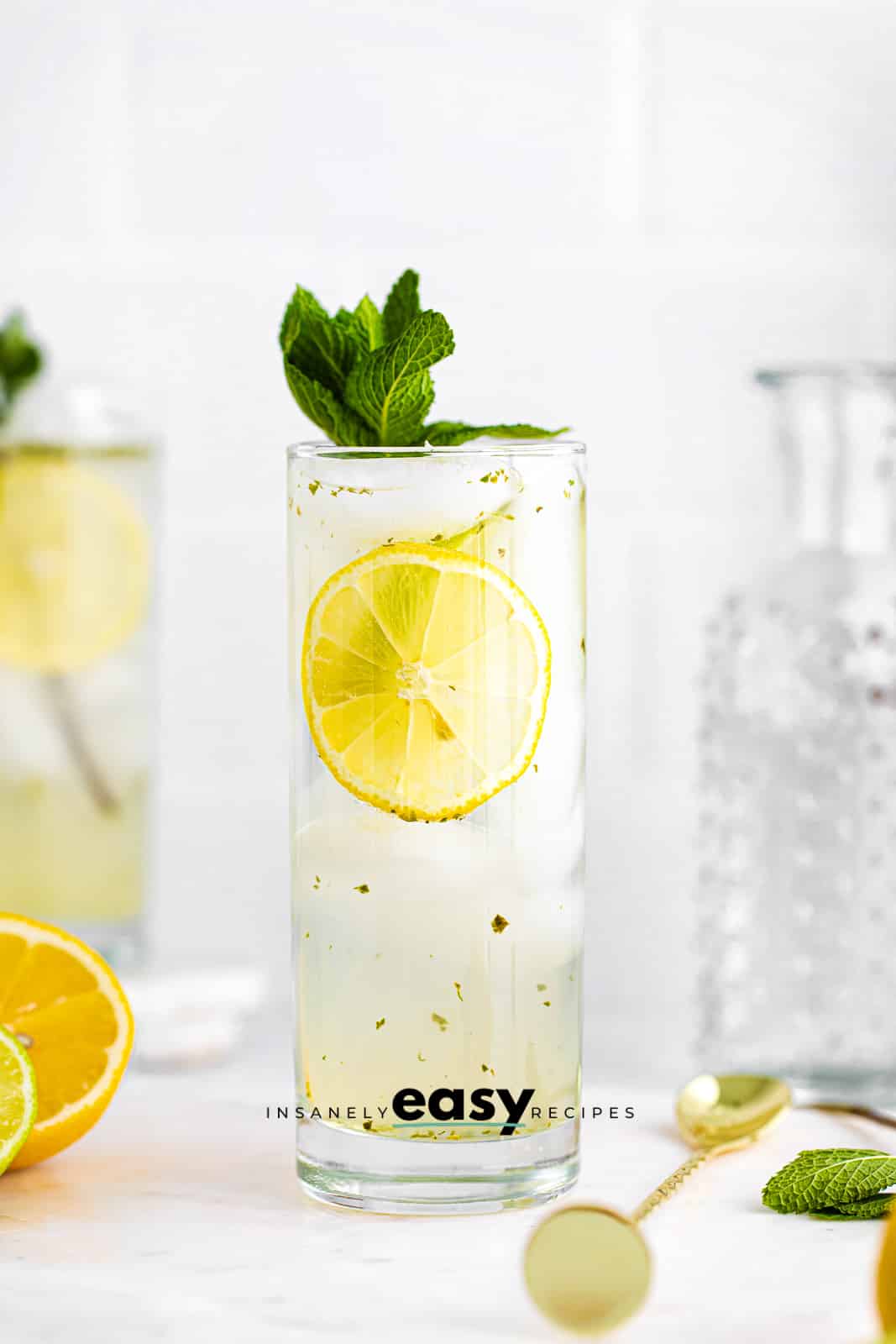 Bootlegger drink in a tall glass, garnished with mint leaves
