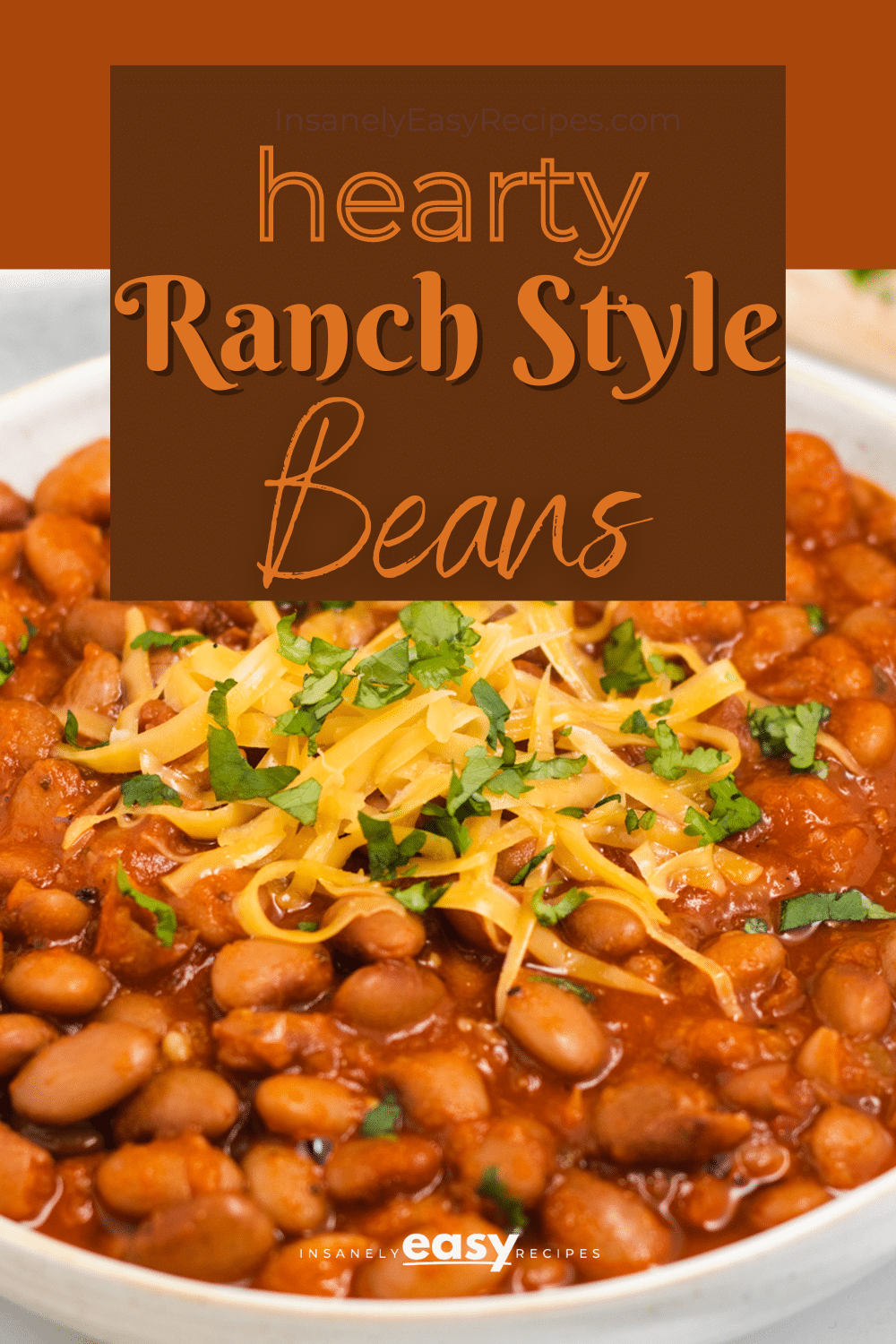 a bowl of beans topped with cheese. Text box overlay says "hearty ranch style beans"