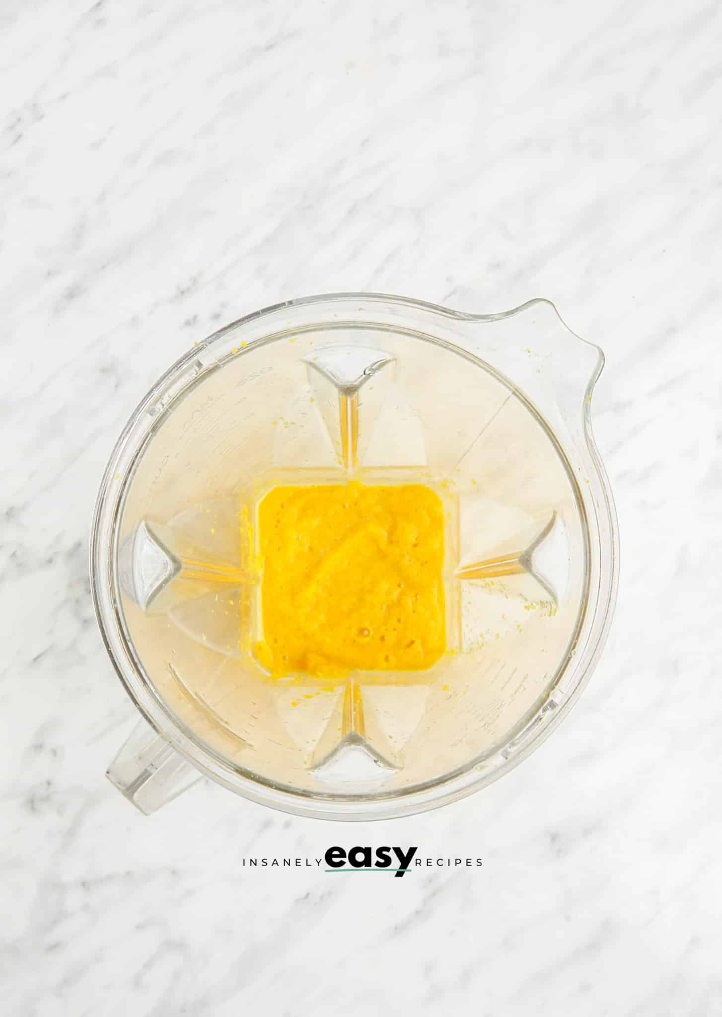 ginger turmeric shot in a blender, viewed from above.