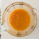 microwave caramel sauce in a glass measuring cup