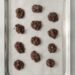 peanut candy made into clusters on a baking sheet.