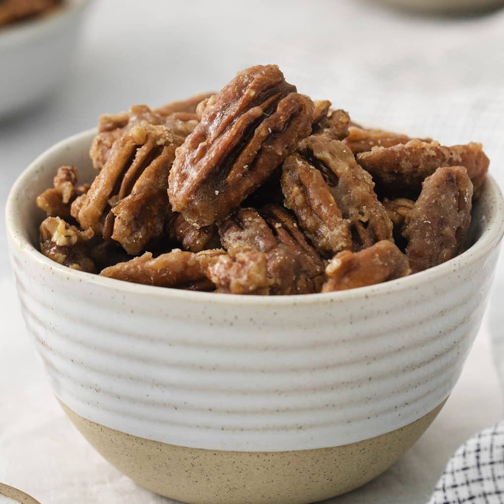 Photo of a bowl filled with Candied Pecans.